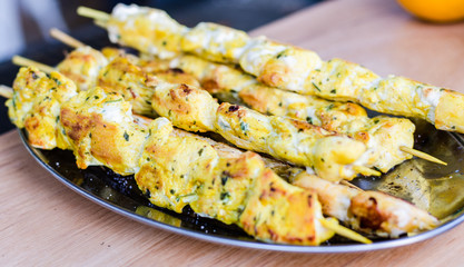 Traditional Brazilian chicken barbecue on skewers at a street food market