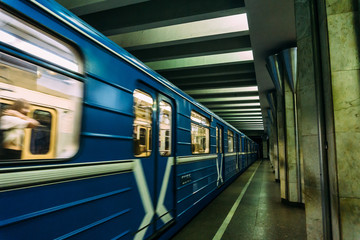 Metro train arrives at the station. Motion blur. Transportation, subway