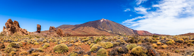 Panoramic view of unique Roque Cinchado unique rock formation with famous Pico del Teide mountain...