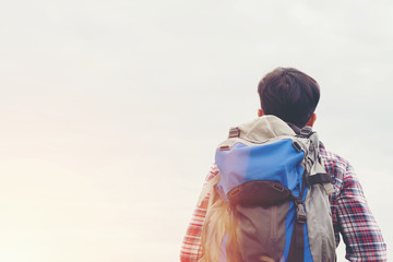 Fototapeta premium Traveler Man with backpack,Travel Lifestyle concept mountains on