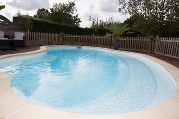 Swimming pool with nobody inside, summer day