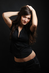 Happy teenage girl primping herself.