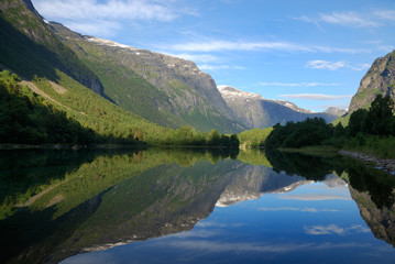 Fototapeta na wymiar Fjord in the middle of green mountains