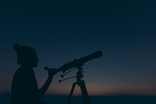 Woman with astronomical telescope. Starry night  Constellations, Ursa major, Leo minor, Leo, Draco Botes, Canes Venatici, Coma Berenices
