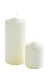 Fototapeta na wymiar Two white candles on a white background