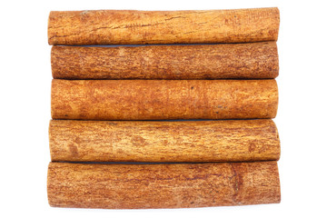 Group of cinnamon sticks isolated on white background, top view