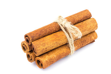 Group of cinnamon sticks isolated on white background.