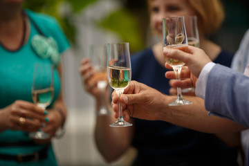 Champagne glasses. People celebrating and drinking champagne from glasses