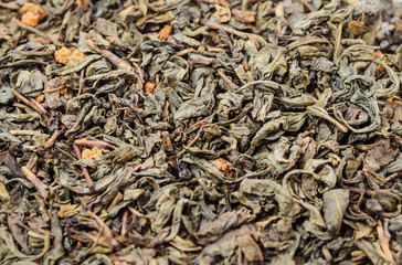 Background of dry green tea with flavors
