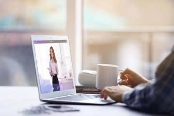 Man video conferencing on laptop. Webinar and consultation online. Modern business technology...