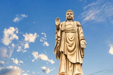 Buddha statue on the blue sky