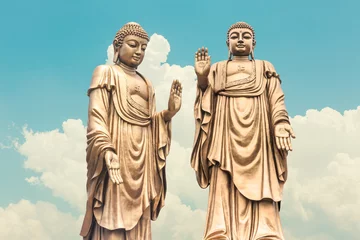 Cercles muraux Bouddha Buddha statue on the blue sky