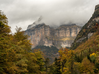 Beautiful and foggy valley in autumn in Pyrenees (Spain)