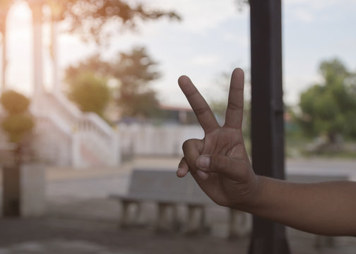 Hand Holding Up The Peace Sign