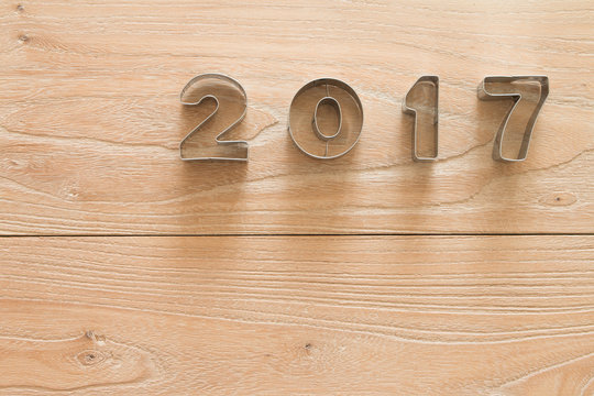 New Year 2017 on a wood background