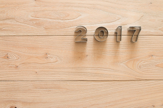 New Year 2017 on a wood background