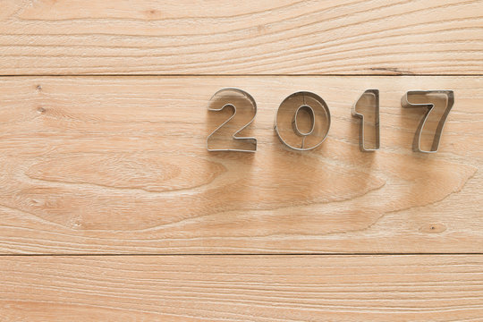 New Year 2017 on a wood background
