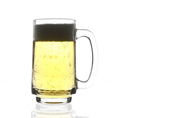 frosty lager light beer and bubbles in clear glass with handle for win