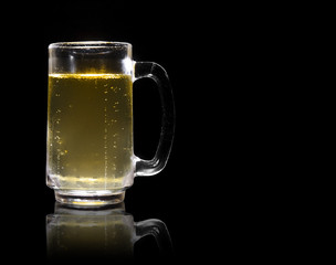 frosty lager light beer and steam in clear glass with handle for winte