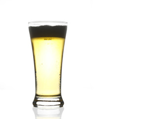 frosty light beer in clear glass with bubbles steam for winter d