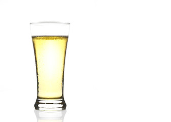 frosty light beer in clear glass with steam for winter drink or