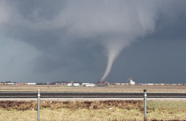 A small cone tornado does damage near Franklin Grove, IL on April 9, 2015. This tornado would later...
