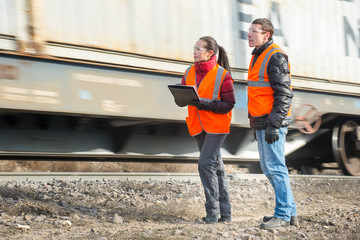 Fototapeta na wymiar Workers at a railway