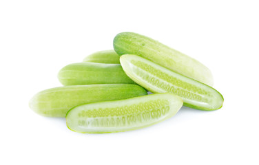 whole and half cut cucumber on white background