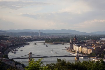 Naklejka premium European landscape with river, bridge and buildings