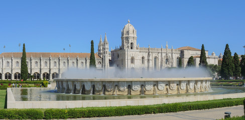 Fototapeta na wymiar Lisbon, Portugal, Belem. Fountain named Luminosa and Gardens in front of Monastery named Jeronimos