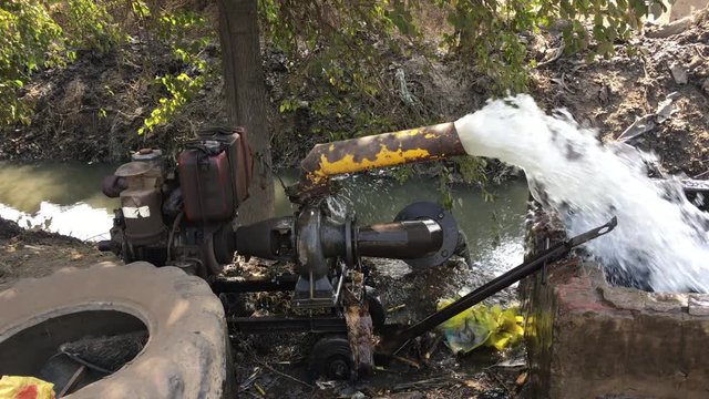 Irrigation Diesel powered water pump, Old Rotary Pump working in field,Egypt.