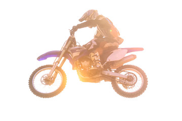 Motocross airbone isolated with sun flare on white background