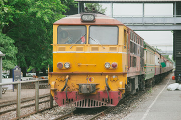 Obraz premium old yellow diesel train in Thailand.