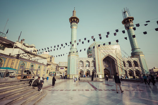 People walking around Emamzadeh Saleh in Teheran, Iran.