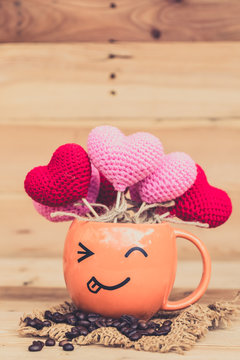 smile coffee cup with heart on wood background, happy love drink coffee concept.