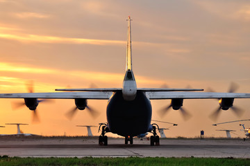 Fototapeta na wymiar Airplane at sunset