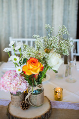 Wedding decoration with pink flowers, gold candels and rose.Romantic