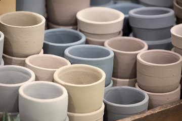 Earth tone colored clay flowerpots