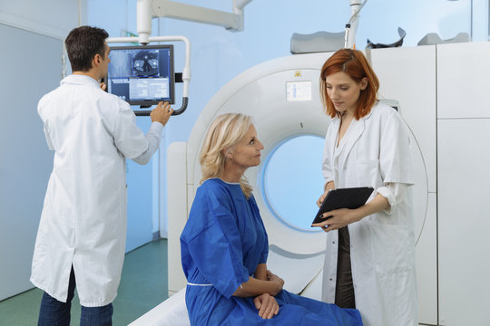 Radiologic technician and Patient being scanned and diagnosed on