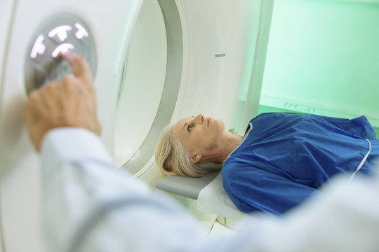 Radiologic technician and Patient being scanned and diagnosed on