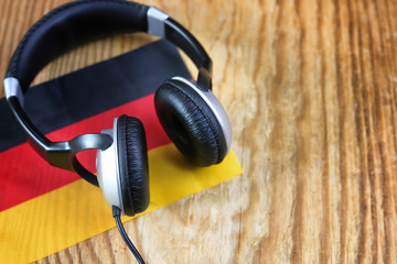 course language headphone and flag on a table