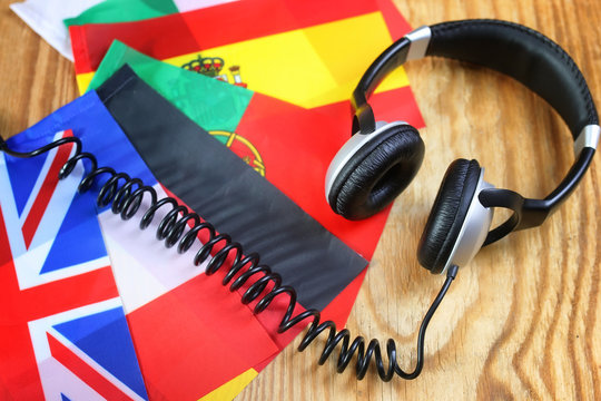 course language headphone and flag on a table