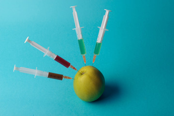 Chemical additives in food or genetically modified fruit concept