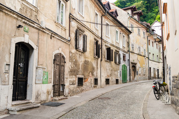 Fototapeta na wymiar LJUBLJANA, SLOVENIA - JUNE 27, 2015: Old street in Slovenian capital Ljubljana