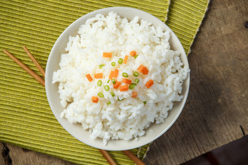 Jasmine rice with chopsticks on a fabric mat