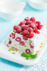 semifredo, italian ice cream dessert, with raspberry and pistach