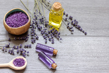 Essential oil and lavender salt with flowers top view