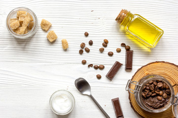 handmade cosmetics coffe scrub top view on wooden background