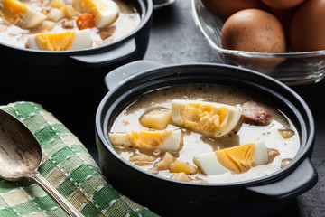 The sour soup made of rye flour with eggs