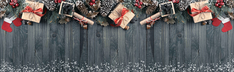 Christmas background with spruce, gift box, Santa Claus boots an